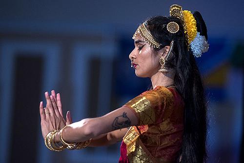 Student dances on stage in a Multicultural Center event